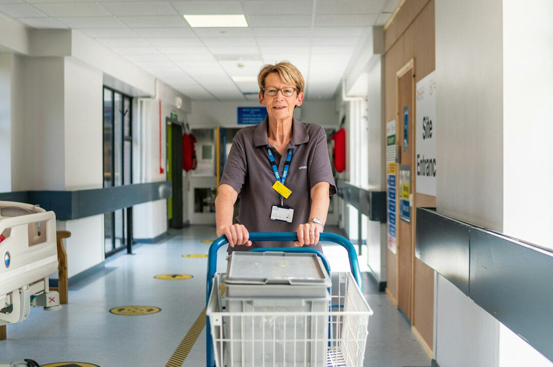Empty hospital corridor with waiting chairs