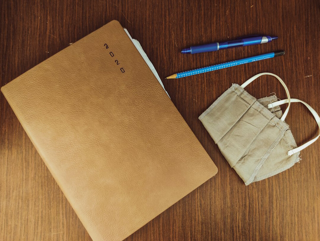 Desk covered with documents and a notebook used for research